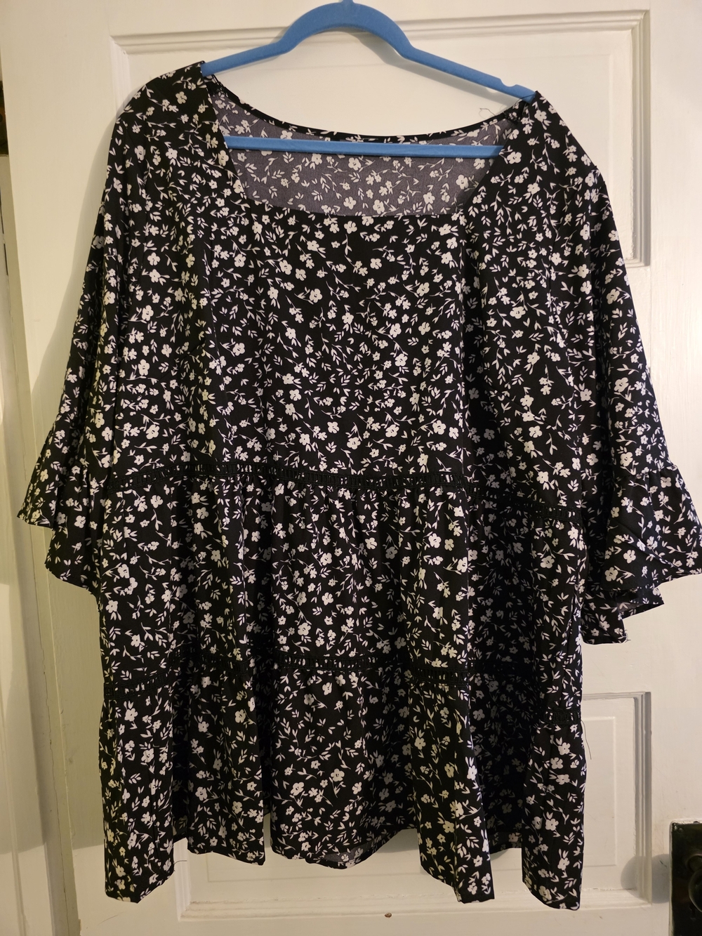 BloomChic Black Top with White Floral Motif
